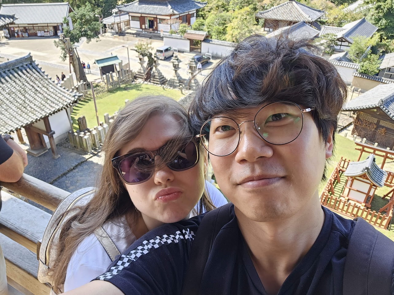The couple taking a photo on their first trip to Japan